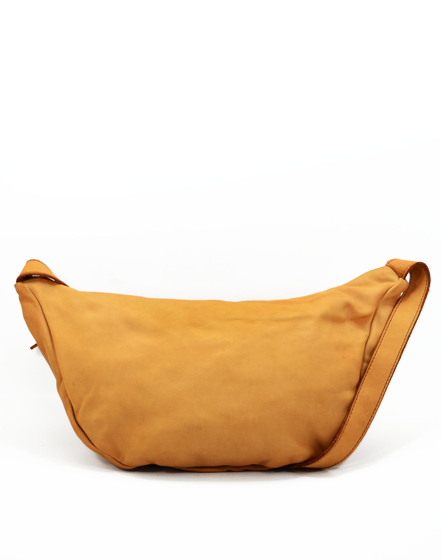 Large crossbody sling bag made with lusciously soft Italian leather in cognac. Back view. . 