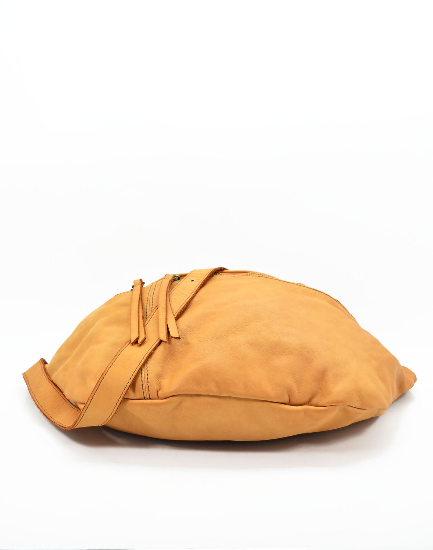 Large crossbody sling bag made with lusciously soft Italian leather in cognac. View laid flat from bottom. 